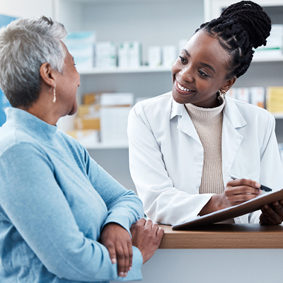 Pharmacist talking with patient.