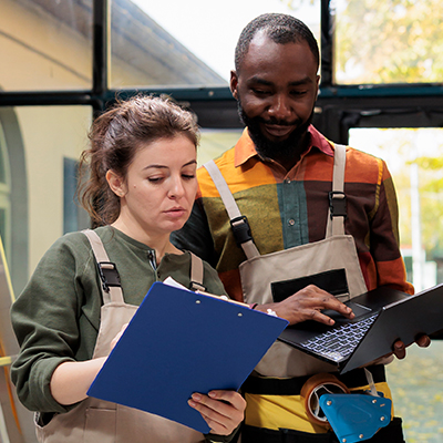 Two students gaining hands on professional experience.