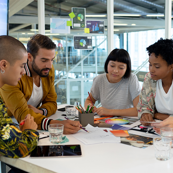 Students collaborating with mentors